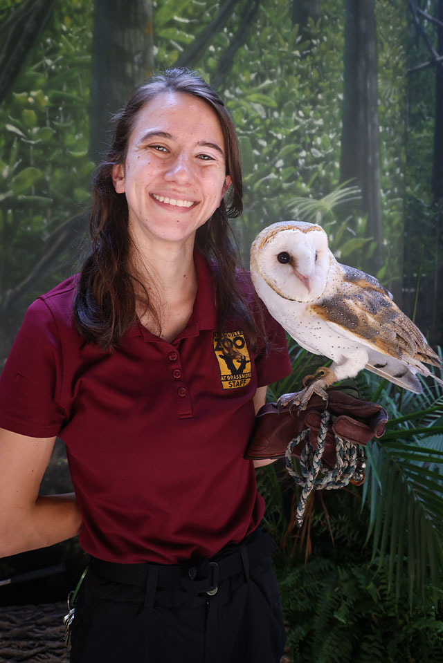 Cameron Luna, Ambassador Animal Keeper, with an owl